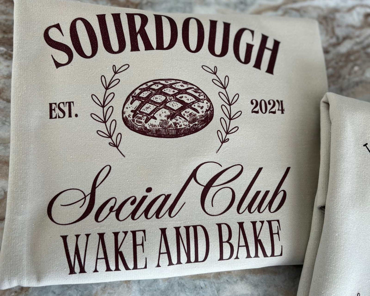 Sourdough Social Club custom crewneck sweatshirt with "Wake and Bake" design.