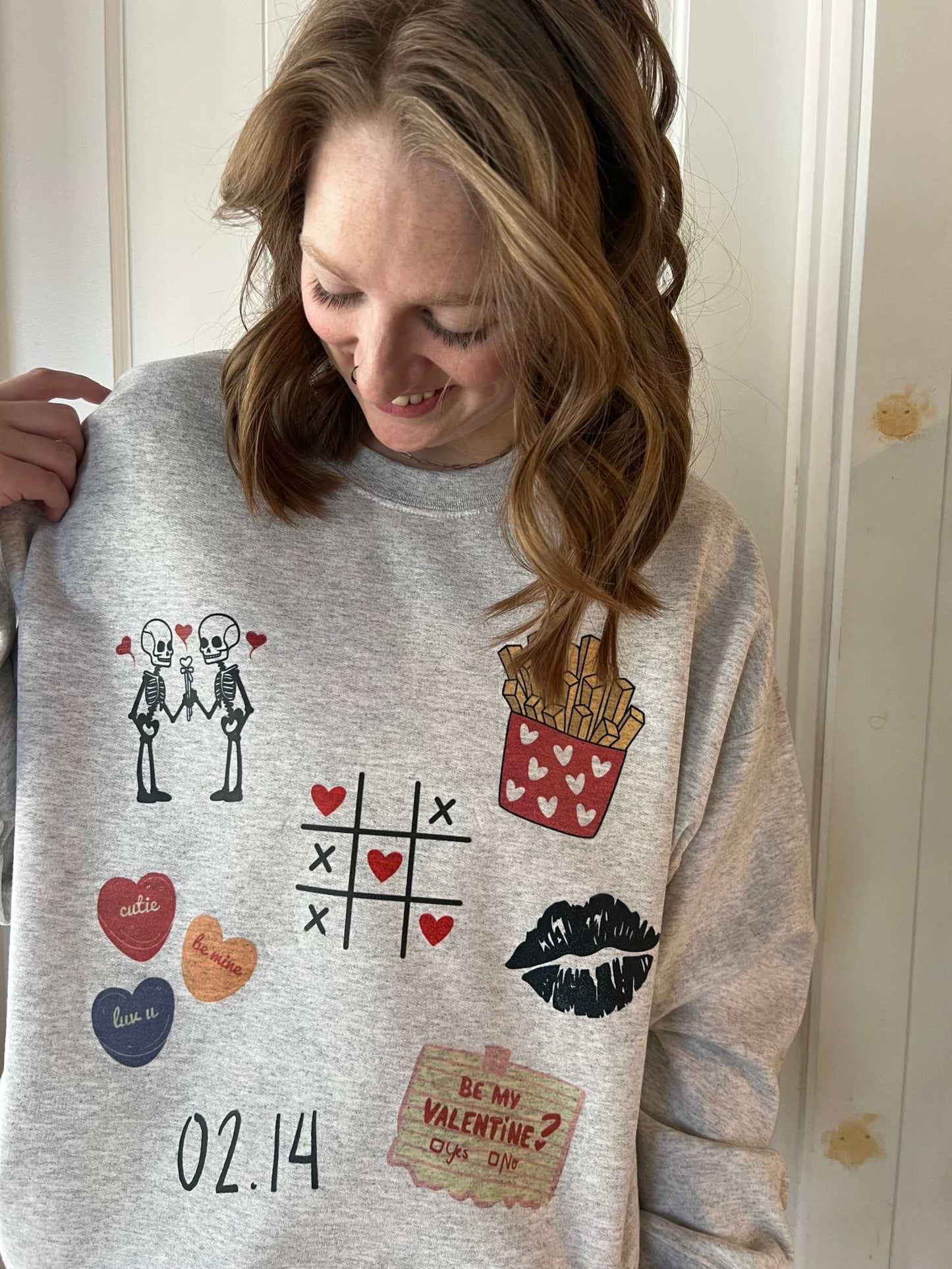 Made of LOVE Valentines crewneck sweatshirt with festive designs.