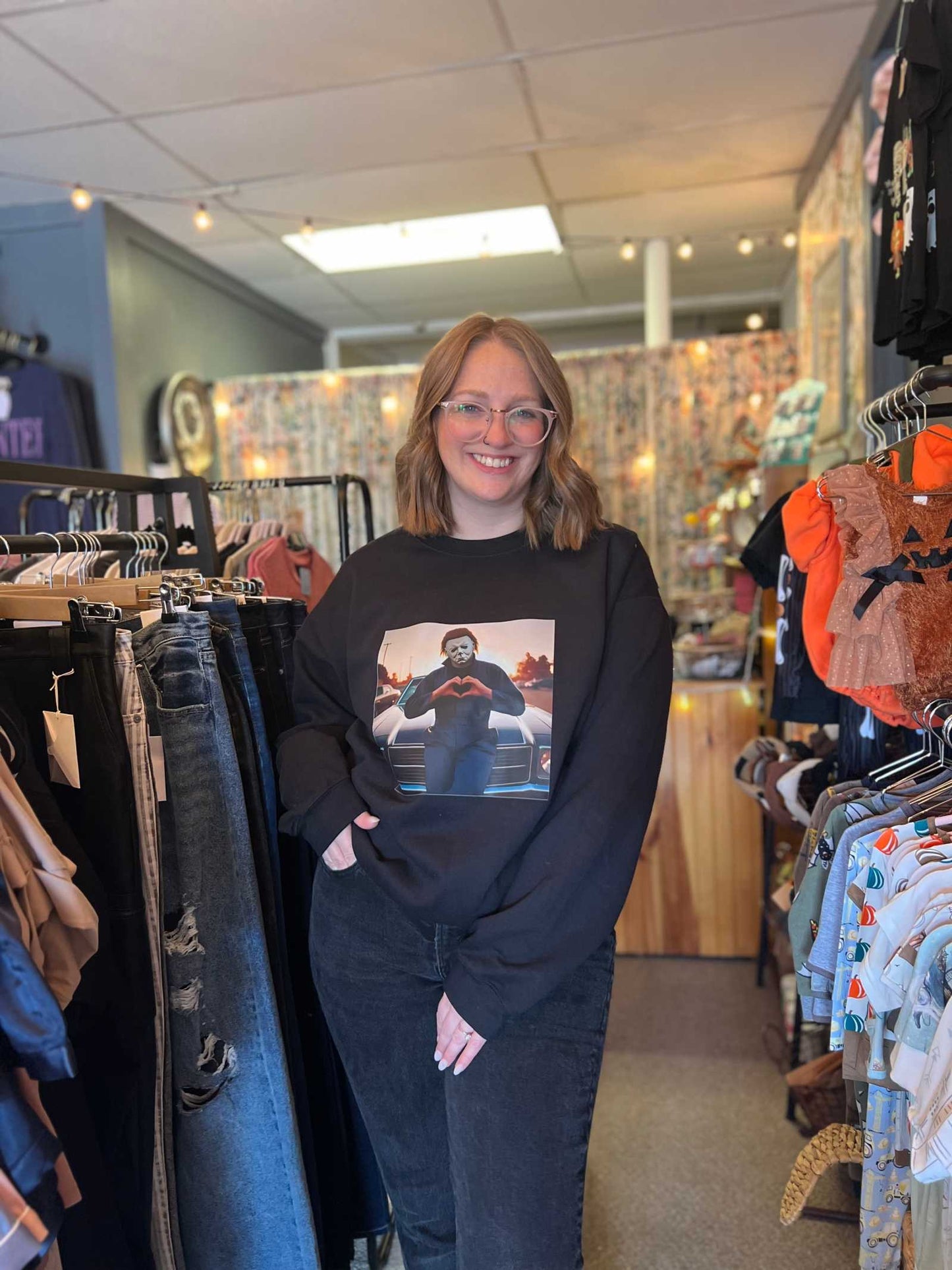Micheal Myers Love Halloween graphic sweatshirt on display in store.