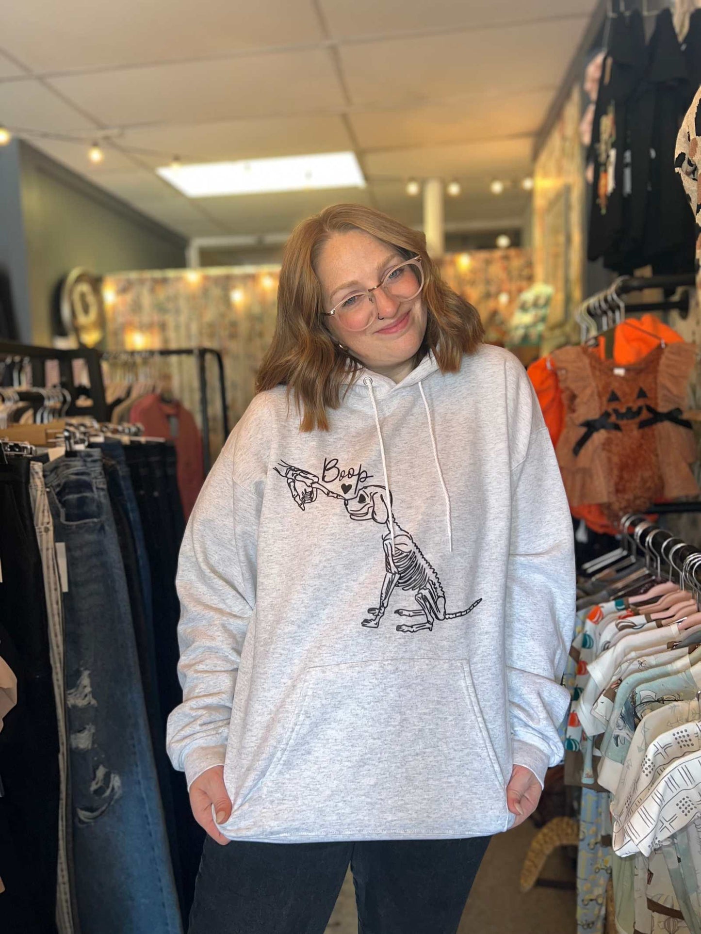 Halloween Graphic Skeleton Dog custom sweatshirts on woman.