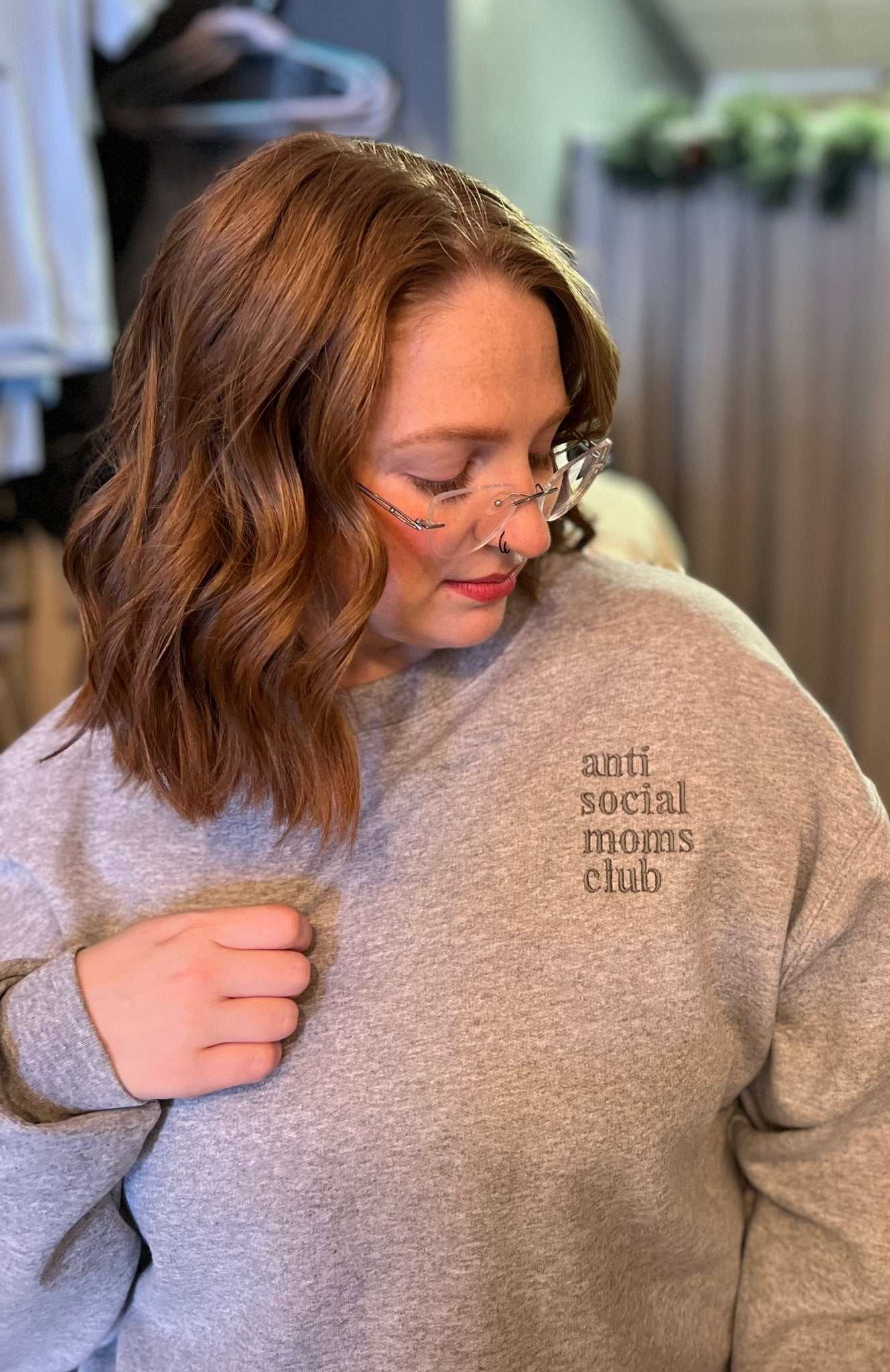 Anti Social Moms Club Embroidered Crewneck Sweatshirt on a woman.